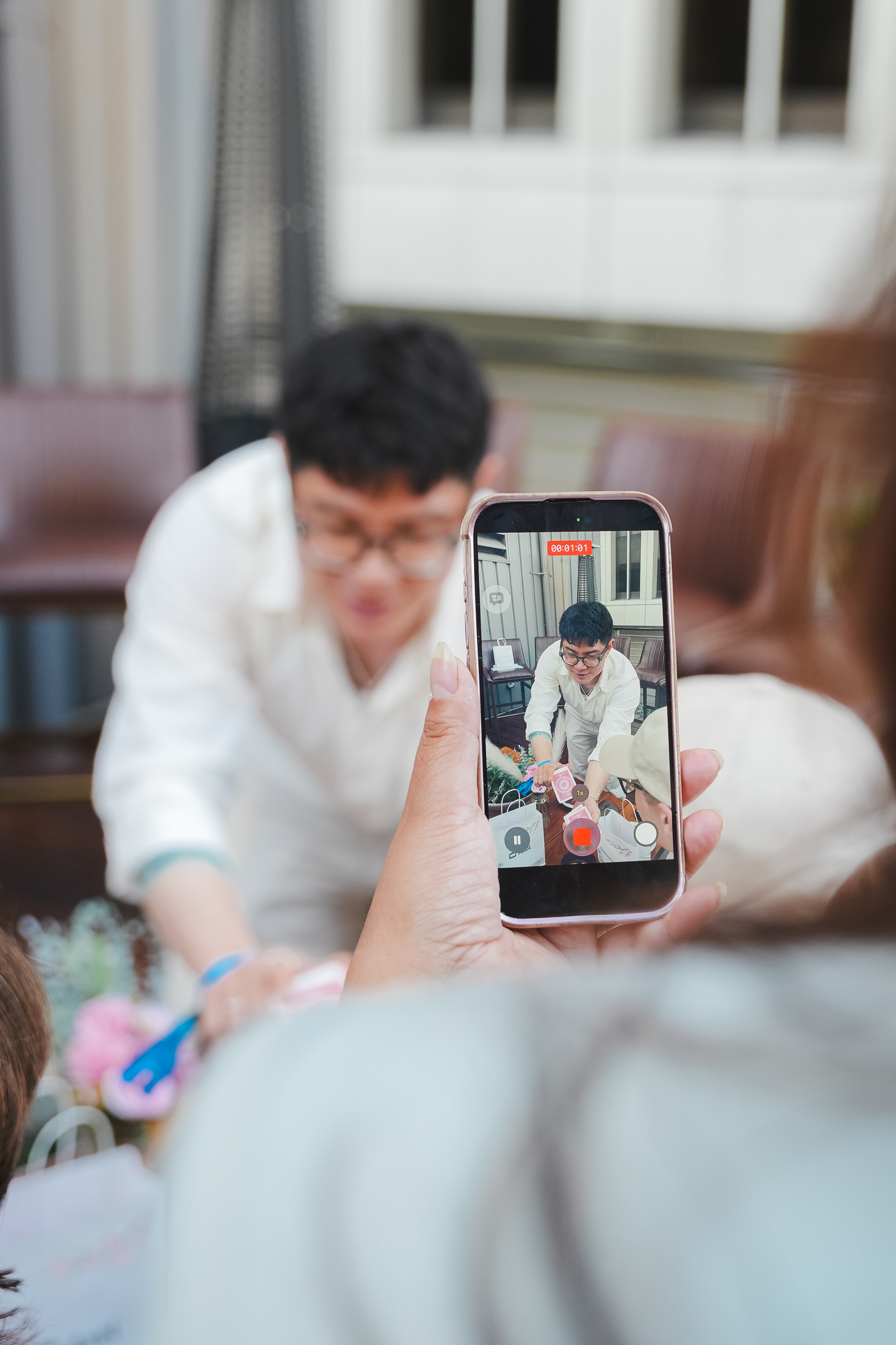 Travis Kim performing close-up magic at a Seattle corporate event